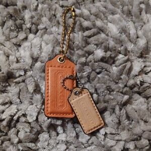Brown and Tan Leather Coach Tags